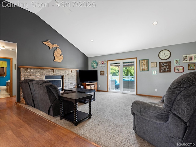 2520 Chilson Meadows Ln, Howell, MI 48843 - living area featuring a fireplace, high vaulted ceiling, wood finished floors, and recessed lighting