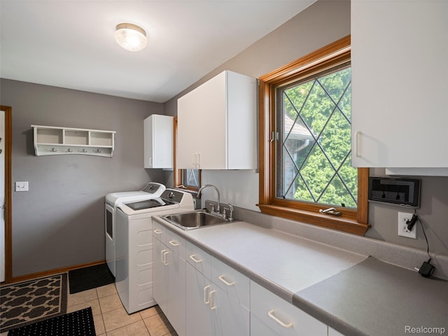 2520 Chilson Meadows Ln, Howell, MI 48843 - washroom with washing machine and dryer, cabinet space, and light tile patterned floors
