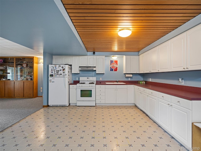 2520 Chilson Meadows Ln, Howell, MI 48843 - kitchen featuring white appliances, wood ceiling, extractor fan, white cabinetry, and dark countertops