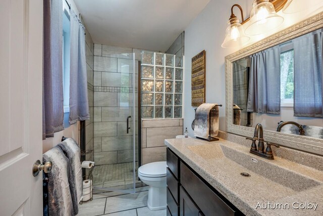 5980 Division St, Newaygo, MI 49337 - full bathroom with vanity, a stall shower, and tile patterned floors