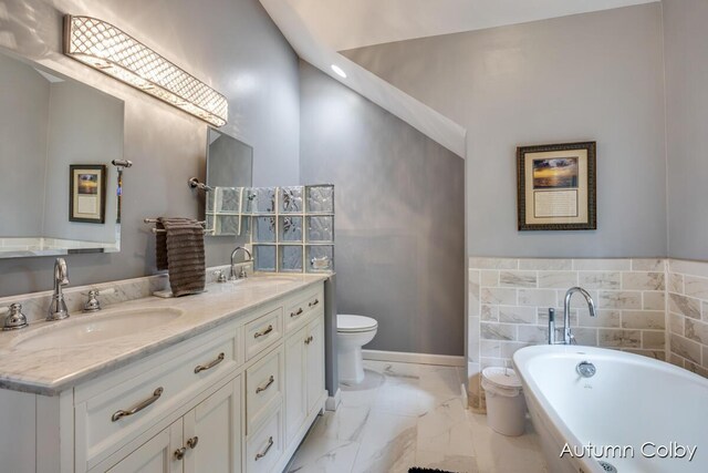 5980 Division St, Newaygo, MI 49337 - full bath with marble look tile flooring, a soaking tub, and double vanity