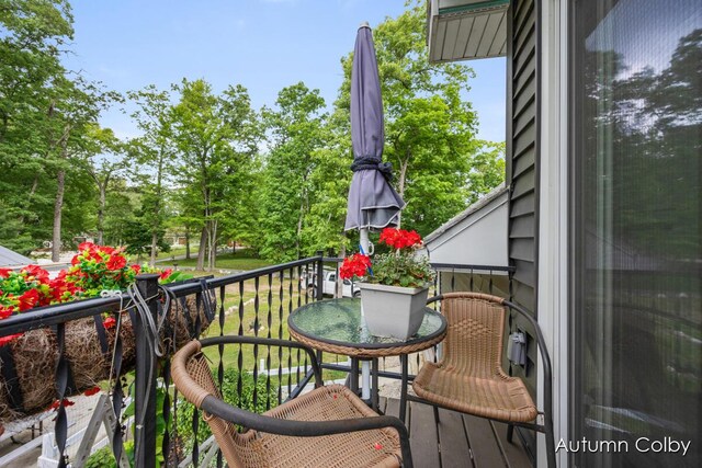 5980 Division St, Newaygo, MI 49337 - balcony featuring view of wooded area