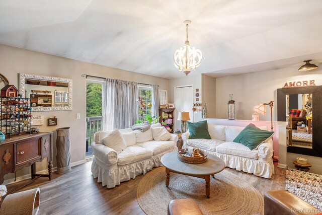 4022 Stonebridge, Holly, MI 48442 - living room with a chandelier and wood finished floors