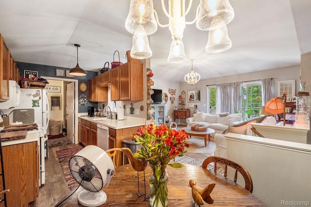 4022 Stonebridge, Holly, MI 48442 - dining room featuring a chandelier, wood finished floors, and lofted ceiling