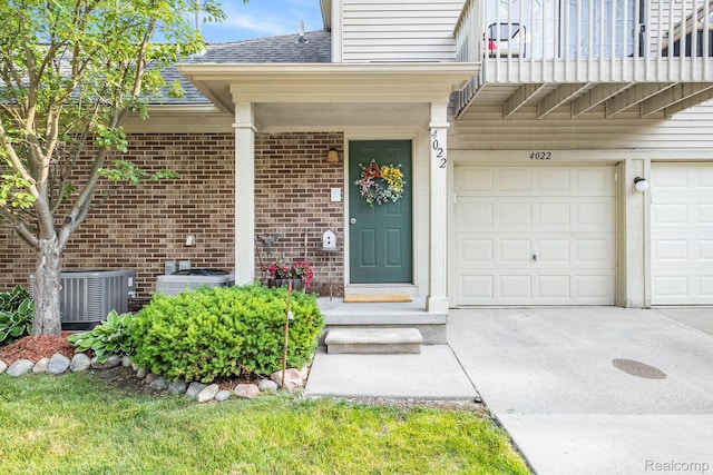 4022 Stonebridge, Holly, MI 48442 - property entrance with roof with shingles, driveway, a garage, brick siding, and a balcony