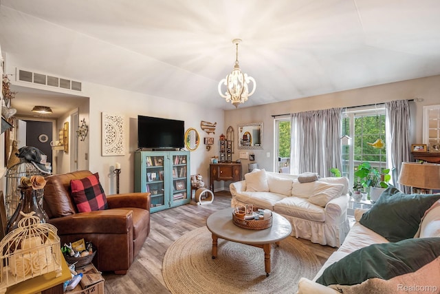 4022 Stonebridge, Holly, MI 48442 - living room featuring light wood-style flooring and a chandelier