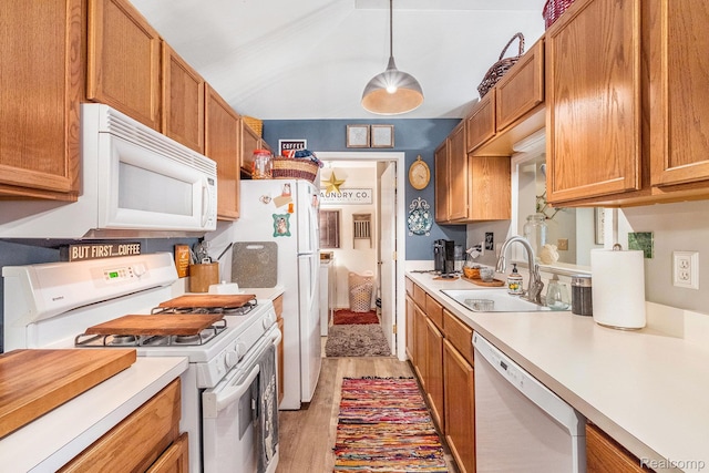 4022 Stonebridge, Holly, MI 48442 - kitchen with white appliances, light countertops, light wood-style flooring, and brown cabinetry