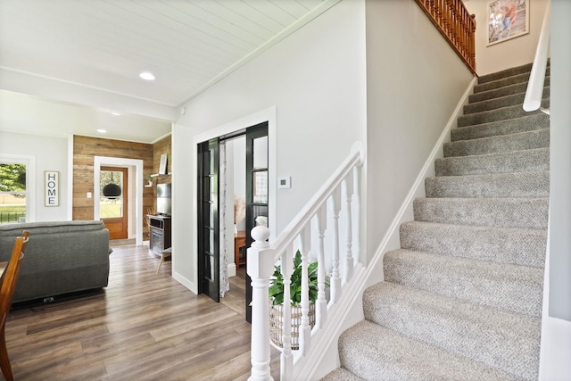 1105 W Genesee St, Frankenmuth, MI 48734 - staircase featuring wood finished floors, recessed lighting, and wooden walls