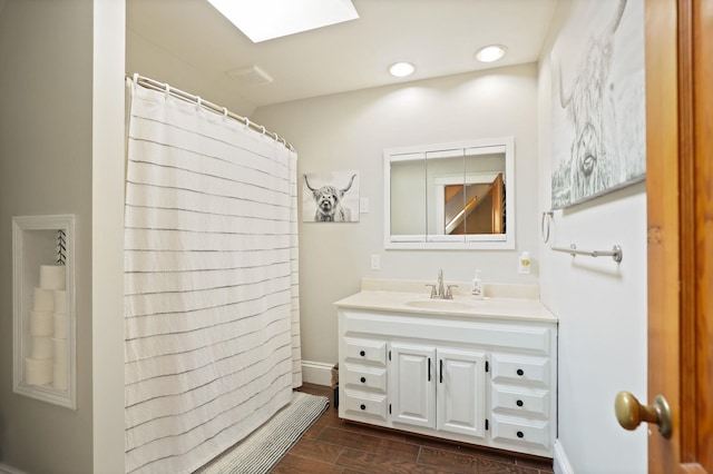 1105 W Genesee St, Frankenmuth, MI 48734 - full bathroom featuring vanity, a skylight, and a shower with curtain