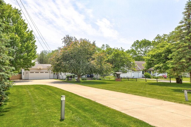 1105 W Genesee St, Frankenmuth, MI 48734 - view of front of house featuring driveway and an attached garage