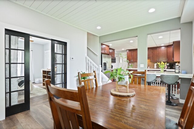 1105 W Genesee St, Frankenmuth, MI 48734 - dining room featuring recessed lighting, wood finished floors, and stairs
