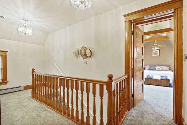 1105 W Genesee St, Frankenmuth, MI 48734 - hallway with an upstairs landing, carpet, a chandelier, baseboard heating, and lofted ceiling