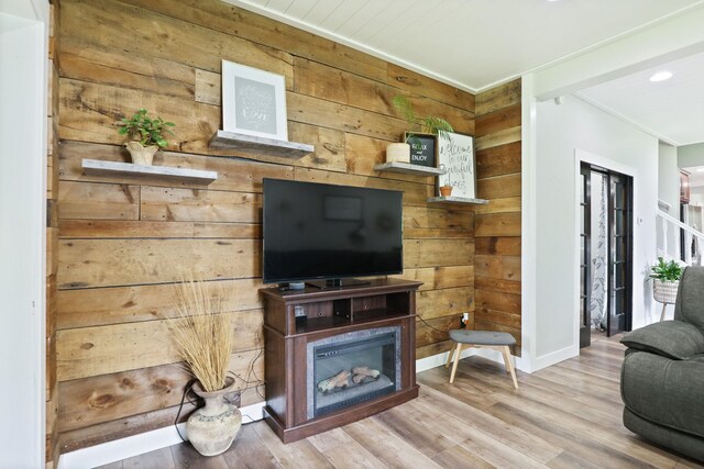 1105 W Genesee St, Frankenmuth, MI 48734 - living room with wooden walls, wood finished floors, a fireplace, and recessed lighting