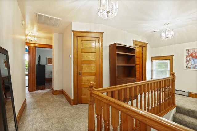 1105 W Genesee St, Frankenmuth, MI 48734 - corridor with a chandelier, light colored carpet, an upstairs landing, and a baseboard heating unit
