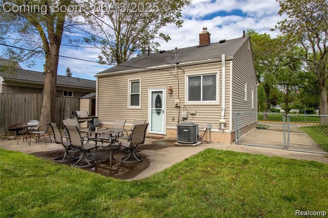 4033 Oakshire Ave, Berkley, MI 48072 - back of house featuring a chimney, a patio area, a fenced backyard, and a storage shed