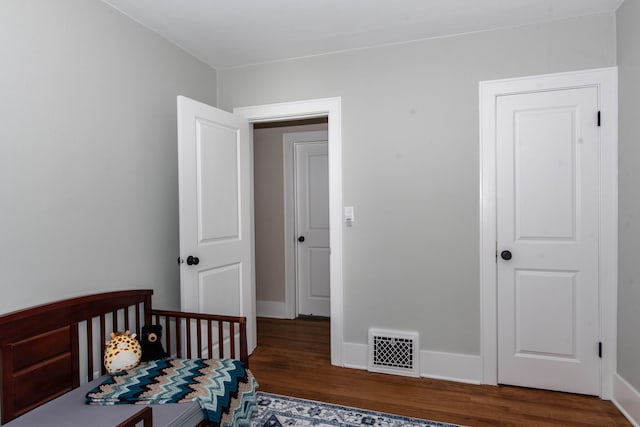 1303 Homecrest Ave, Kalamazoo, MI 49001 - bedroom with wood finished floors and baseboards