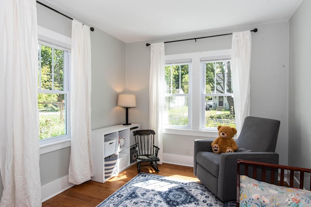 1303 Homecrest Ave, Kalamazoo, MI 49001 - sitting room with healthy amount of natural light and wood finished floors