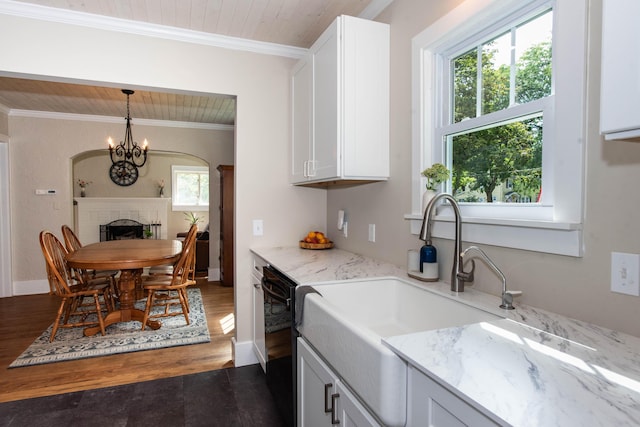1303 Homecrest Ave, Kalamazoo, MI 49001 - kitchen featuring black dishwasher, light stone countertops, white cabinets, wooden ceiling, and ornamental molding