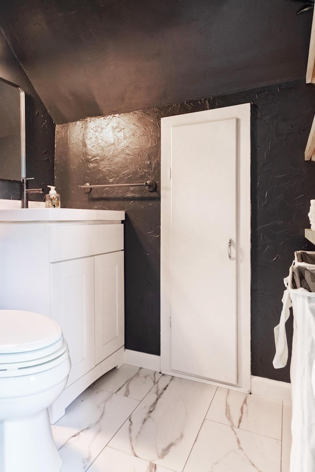 1303 Homecrest Ave, Kalamazoo, MI 49001 - bathroom with vanity and marble look tiles
