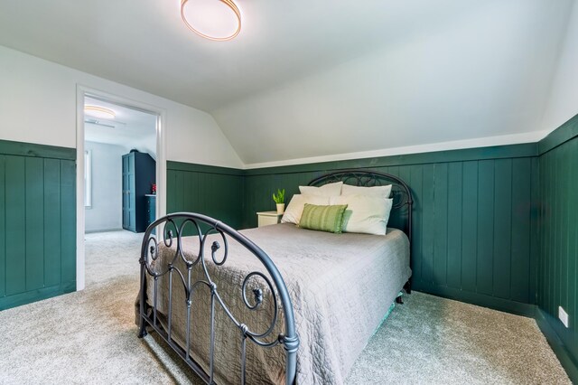 1303 Homecrest Ave, Kalamazoo, MI 49001 - bedroom with carpet floors, vaulted ceiling, and wainscoting