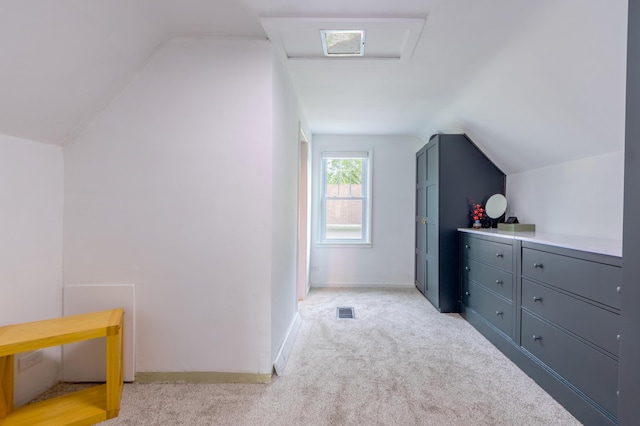 1303 Homecrest Ave, Kalamazoo, MI 49001 - bedroom with vaulted ceiling and light carpet