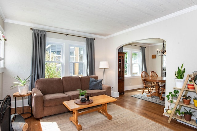1303 Homecrest Ave, Kalamazoo, MI 49001 - living area with light wood-type flooring, arched walkways, ornamental molding, a chandelier, and wooden ceiling