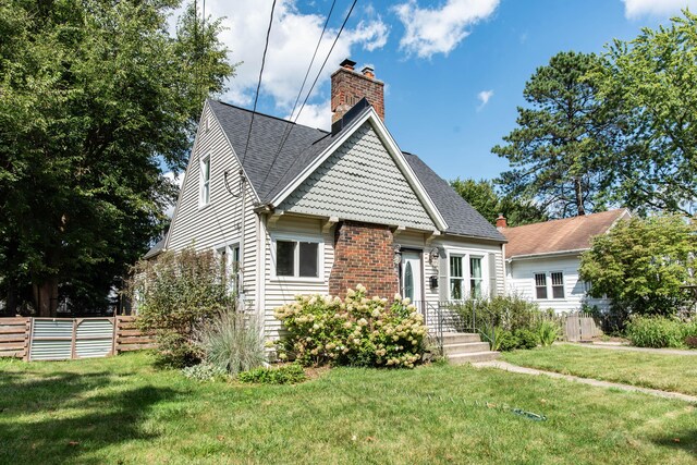 1303 Homecrest Ave, Kalamazoo, MI 49001 - victorian house featuring a chimney and roof with shingles