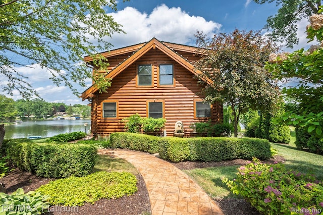 2757 S Hacker Rd, Brighton, MI 48114 - view of front of house with log siding and a water view