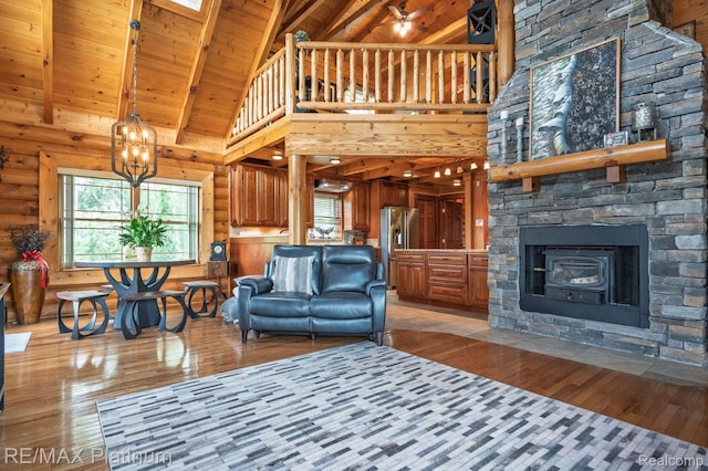 2757 S Hacker Rd, Brighton, MI 48114 - living area featuring light wood-style flooring, high vaulted ceiling, a wooden ceiling with exposed beams, and a chandelier
