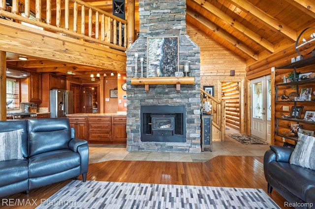 2757 S Hacker Rd, Brighton, MI 48114 - living area with high vaulted ceiling, a wood ceiling with exposed beams, rustic walls, and light wood-style flooring