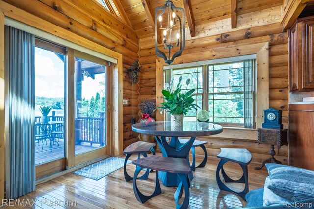 2757 S Hacker Rd, Brighton, MI 48114 - dining room with healthy amount of natural light, wooden ceiling, hardwood / wood-style flooring, log walls, and a chandelier
