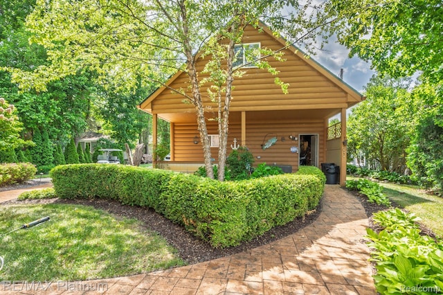 2757 S Hacker Rd, Brighton, MI 48114 - view of front of house with faux log siding
