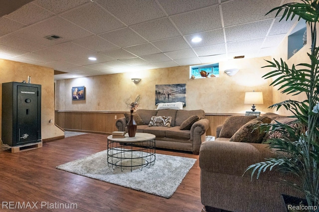 2757 S Hacker Rd, Brighton, MI 48114 - living room featuring a drop ceiling, wood finished floors, a wainscoted wall, and recessed lighting