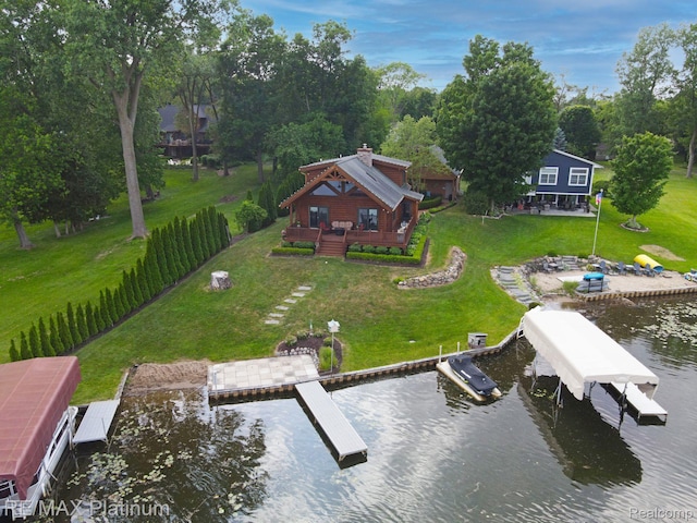 2757 S Hacker Rd, Brighton, MI 48114 - dock area with a lawn and a deck with water view