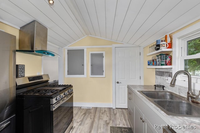 340 E Main St SE, Caledonia, MI 49316 - kitchen with gas range, wall chimney range hood, lofted ceiling, light wood-style flooring, and wood ceiling