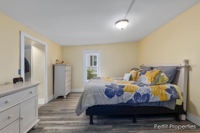 340 E Main St SE, Caledonia, MI 49316 - bedroom with wood finished floors and baseboards