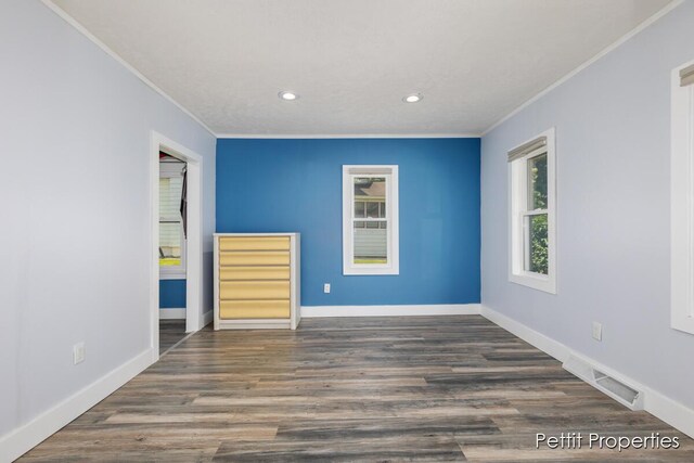 340 E Main St SE, Caledonia, MI 49316 - unfurnished room with ornamental molding, recessed lighting, and wood finished floors
