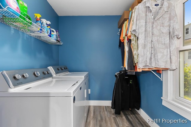 340 E Main St SE, Caledonia, MI 49316 - washroom with washer and dryer, wood finished floors, and plenty of natural light