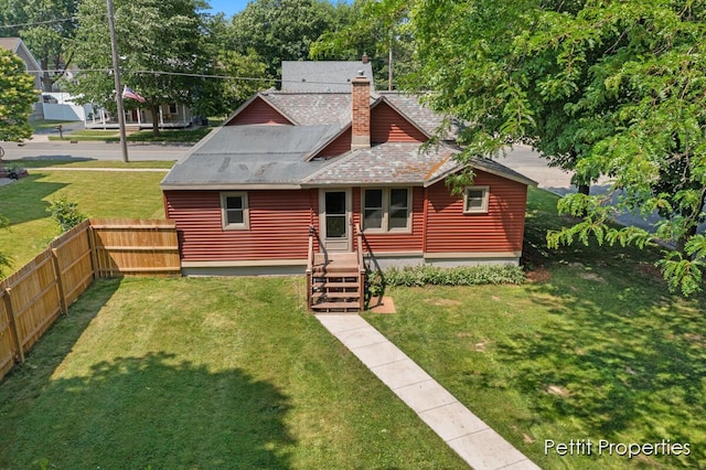 340 E Main St SE, Caledonia, MI 49316 - rear view of property featuring a chimney and roof with shingles
