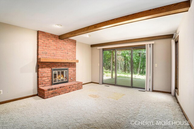 6555 Waybridge Dr SE, Grand Rapids, MI 49546 - unfurnished living room featuring carpet floors, a fireplace, and beamed ceiling