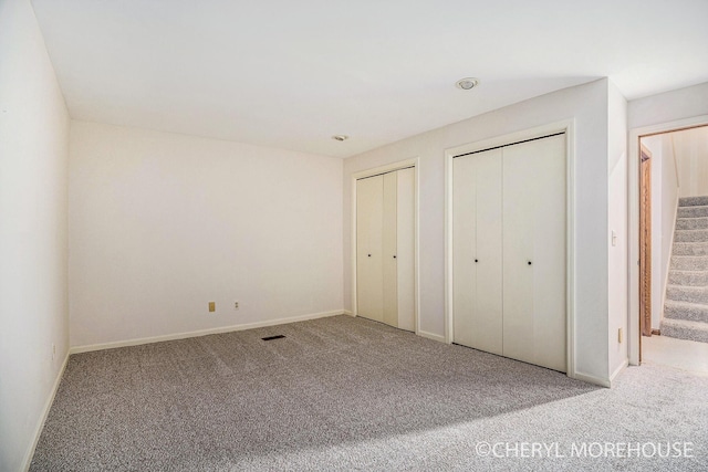 6555 Waybridge Dr SE, Grand Rapids, MI 49546 - unfurnished bedroom with multiple closets and carpet floors