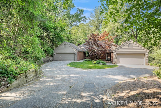 6555 Waybridge Dr SE, Grand Rapids, MI 49546 - view of property hidden behind natural elements featuring an outbuilding