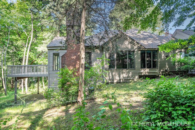 6555 Waybridge Dr SE, Grand Rapids, MI 49546 - back of house with a deck and roof with shingles