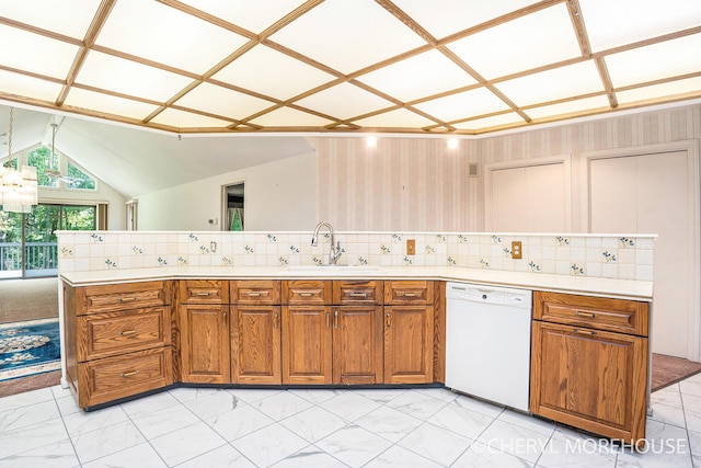 6555 Waybridge Dr SE, Grand Rapids, MI 49546 - kitchen featuring white dishwasher, brown cabinets, backsplash, and lofted ceiling