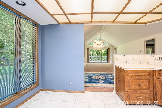6555 Waybridge Dr SE, Grand Rapids, MI 49546 - bathroom featuring a chandelier, vanity, and vaulted ceiling