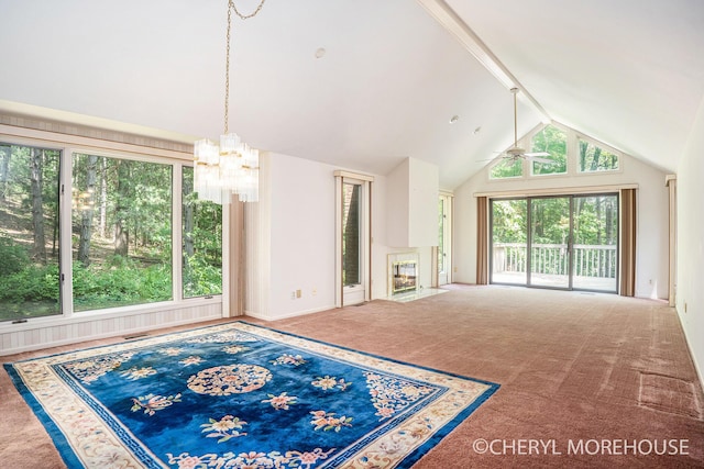 6555 Waybridge Dr SE, Grand Rapids, MI 49546 - unfurnished living room with a chandelier, carpet flooring, a ceiling fan, and a fireplace with flush hearth