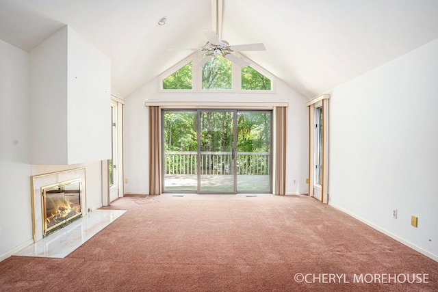 6555 Waybridge Dr SE, Grand Rapids, MI 49546 - unfurnished living room with carpet floors, ceiling fan, a high end fireplace, and lofted ceiling
