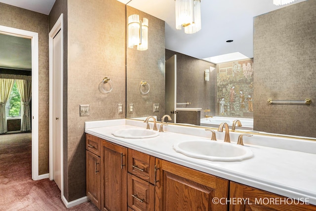 6555 Waybridge Dr SE, Grand Rapids, MI 49546 - full bathroom with double vanity and a garden tub