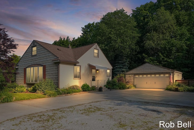 3897 Obrien St SW, Grand Rapids, MI 49534 - view of front of house with an outdoor structure, a garage, and a shingled roof