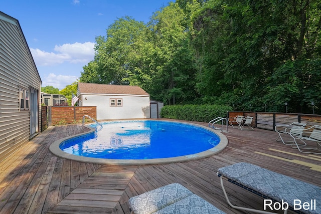 3897 Obrien St SW, Grand Rapids, MI 49534 - view of swimming pool featuring a deck and an outdoor structure